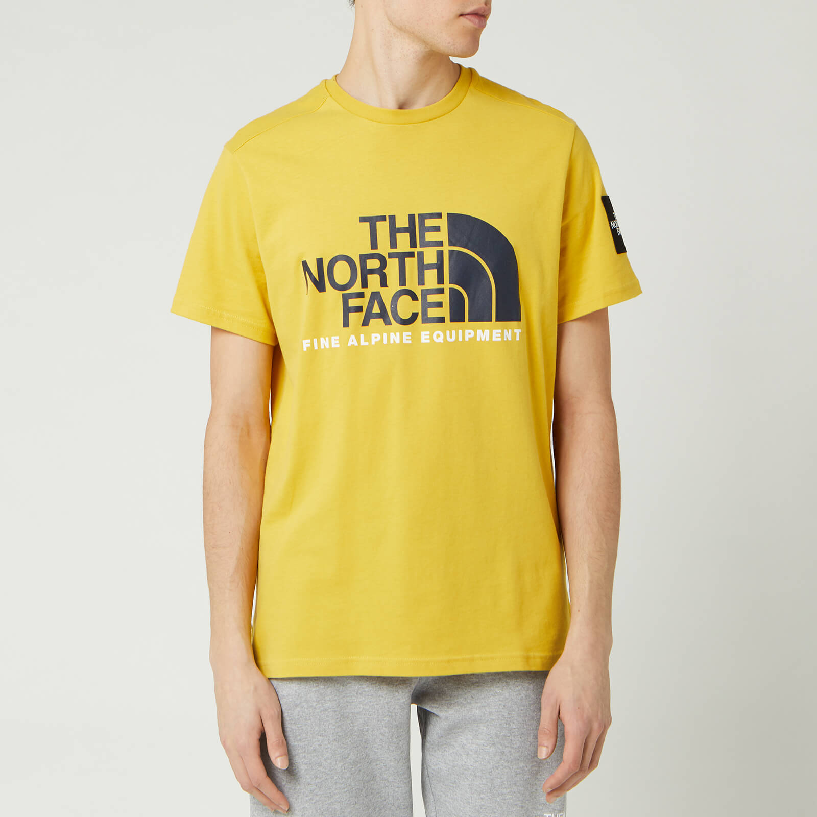 mens yellow north face t shirt