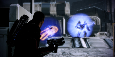 The player's character, looking towards a large enemy surrounded by blue light