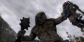 A large troll-like creature, holding up a person in one hand