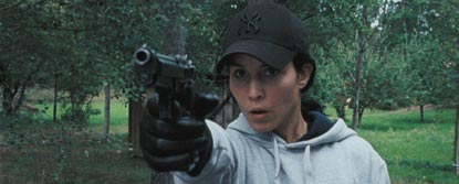 Noomi Rapace As Lisbeth Salander Aiming A Gun