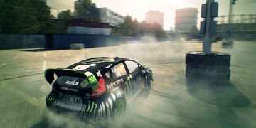 Ken Block's famous Ford Fiesta doing doughnuts round some tyres