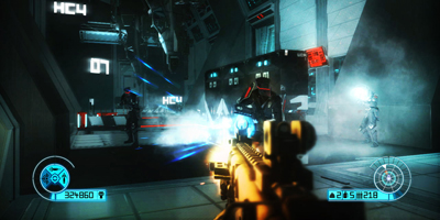 A player, looking down his sight whilst firing at a group of enemies