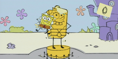 Spongebob, next to a large statue of himself
