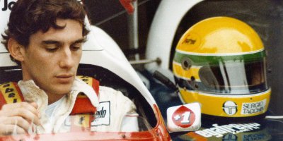 Ayrton Senna Sat In His Car With His Helmet Next To Him