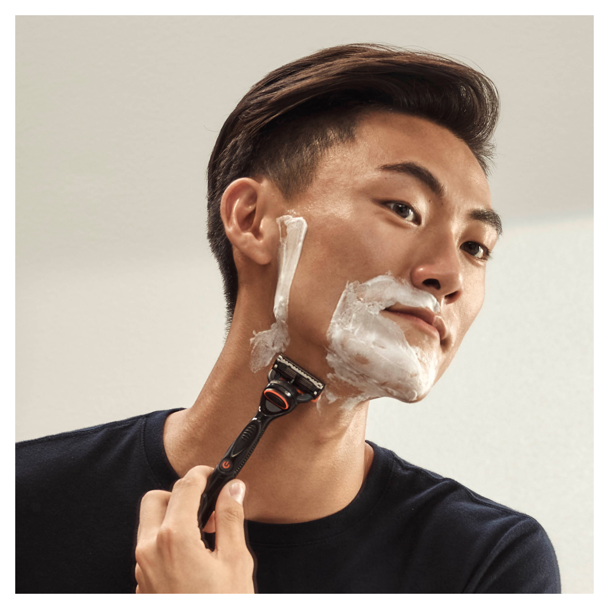 Man shaving face