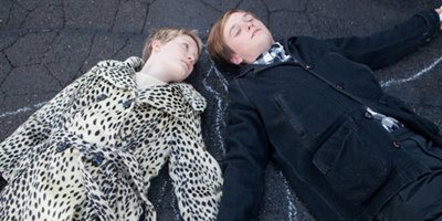 Enoch and Annabel Lying on the Tarmac