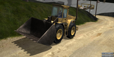 A big digger, driving up a slight hill