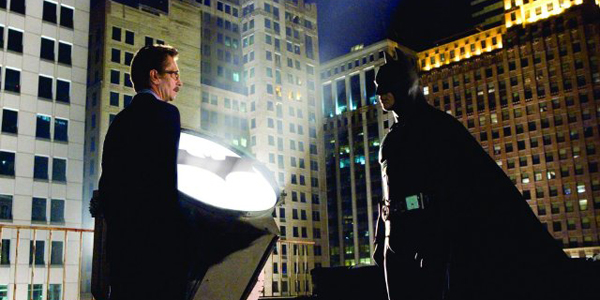 Christian Bale and Gary Oldman Stood Next to Batman Light