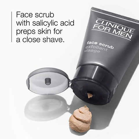Image 4 - A dark gray tube of Clinique For Men face scrub with an open cap is shown with a dollop of tan-colored scrub on a white surface, with visible text reading CLINIQUE FOR MEN, face scrub, exfoliant visage, Face scrub with salicylic acid preps skin for a close shave. Image 5 - Two clear dishes are shown on a white background, with white powder labeled Salicylic acid in the top right dish and a clear liquid with white and grey particles labeled Silica in the bottom left dish. Image 7 - A light peach textured background with a wavy line icon and the word exfoliate.