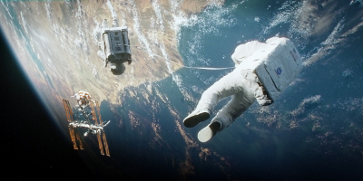 Stone And Kowlaski Tethered to Each Other in Space