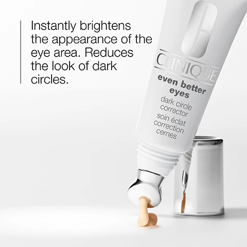 Image 1 - A tube of Clinique Even Better Eyes Dark Circle Corrector is shown dispensing a small amount of cream with the text, Instantly brightens the appearance of the eye area. Reduces the look of dark circles.
              Image 2 - A woman with long dark hair is applying a skincare product under her left eye using a silver roller applicator; the product appears to be a light cream or gel.
              Image 3 - A close-up of a shimmery, golden surface featuring icons for refresh and brighten with the text refresh and brighten.
              Image 4 - Image shows two clear glass containers next to a light green vertically striped background with text indicating the product is free of fragrance, sodium lauryl sulfate, and sodium laureth sulfate.