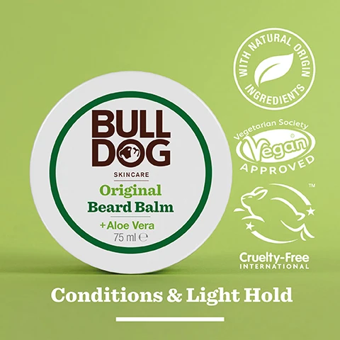 Image 2 - A round container of Bulldog Skincare Original Beard Balm labeled with the product name, Original Beard Balm + Aloe Vera, and features icons indicating it has natural origin ingredients, is vegan approved, and cruelty-free, set against a green background with the text Conditions & Light Hold at the bottom.
              Image 3 - A close-up image of an aloe vera leaf with a glossy gel, featuring text that reads 96% Natural Origin and Unlock the true potential of natural origin ingredients, along with Conditions & Light Hold.
              Image 4 - A person is holding a container of Bulldog Original Beard Balm, with the lid being opened to reveal the creamy product inside, and visible text reads For All Beard Types.
              Image 5 - A round jar of Bulldog Original Beard Balm is placed on a countertop with visible text stating 98.5% Recycled PCR Plastic Jar and a recycling logo that indicates it is a recycled plastic jar.
              Image 6 - Three Bulldog Skincare products for beard care are displayed on a shelf: a small bottle of Original Beard Oil, a larger bottle labeled Original Beard Shampoo & Conditioner, and a round container of Original Beard Balm, with the text Tame Your Beard visible at the bottom.