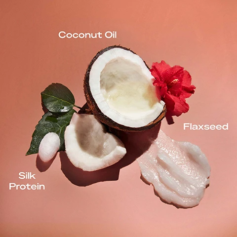 Image 1 - An open coconut with its white flesh, coconut oil, a sprig of leaves, a red flower, and a small piece of coconut on a pink background with visible text labeling Coconut Oil, Flaxseed, and Silk Protein.
              Image 2 - Image of a jar of SheaMoisture Coconut & Hibiscus Curl Enhancing Smoothie on a peach background, with text that reads Great for curly and coily hair, reduces frizz, defines curls and enhances shine, perfect for twist-out, braid-out or wash-and-go styles, and smooths hair for a soft, silky feel.