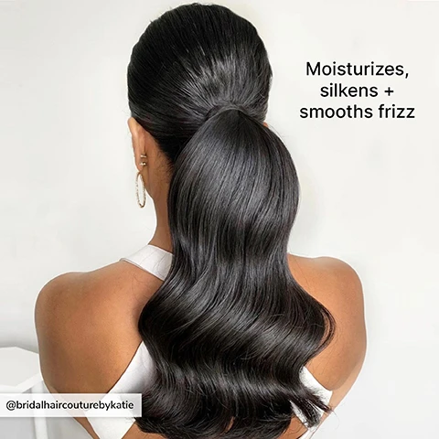 Image 3 - A woman seen from the back has smooth, shiny, long hair styled in loose waves, and wears a white sleeveless top, while the image includes the text that reads Moisturizes, silkens + smooths frizz.
              Image 5 - A person’s head is shown from the back, featuring two braided hairstyles with pastel-colored hair, adorned with gold jewelry and earrings, against a textured light background; visible text reads Tames flyaways + perfect for braiding.
              Image 7 - A silver spray bottle labeled COLOR WOW with black text, featuring the phrase POP & LOCK HIGH GLOSS FINISH and marked as TRAVEL SIZE at the bottom.