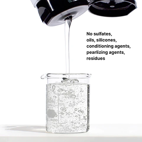Image 3 - A liquid is being poured from a black container into a clear glass beaker filled with bubbling water, with visible text stating No sulfates, oils, silicones, conditioning agents, pearlizing agents, residues.
              Image 4 - A hand holding a bottle of WOW Color Security Shampoo with bubbles surrounding it, accompanied by the text Rich-lathering, sulfate-free.