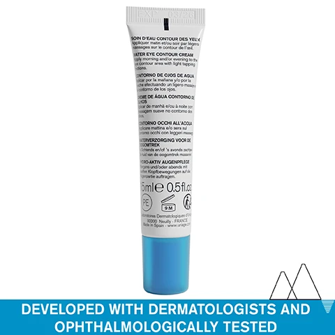 Image 1 - A white cosmetic tube with a blue cap is shown above a blue bar with text including EXP 03/26 SOIN DEAU CONTOUR DES YEUX WATER EYE CONTOUR CREAM Apply morning and/or evening to the eye contour area with light tapping motions 15mle 0.5fl.oz PE 9 M Laboratoires Dermatologiques dUriage 92200 Neuilly - FRANCE Made In Spain - www.uriage.com and on the blue bar DEVELOPED WITH DERMATOLOGISTS AND OPHTHALMOLOGICALLY TESTED. Image 2 - Close up of a persons eye area with drops of cream on the skin below, and text Ultra-refreshing eye cream, Non-sticky, ALL SKIN TYPES - EVEN SENSITIVE. Image 3 - Close-up of a womans face showing her eye and mouth area with text overlaid that says Reduces the appearance of puffiness, dark circles, and dehydration lines. Image 4 - Chart listing skincare ingredients and their benefits on a blue background with a white mountain graphic featuring the text HYALURONIC ACID Hydrates the skin, H₂O COMPLEX + AQUAXYL Moisturize and boost hydration, DEXTRAN SULFATE Decongests, URIAGE THERMAL WATER 100% pure & natural softens and soothes all skin types, ADVANCED DERMATOLOGICAL FORMULA. Image 5 - Landscape of snow-capped mountains reflected in a lake with icons and text Dermatologically tested, Suitable for all skin types, Fragrance-free, Ophthalmologically tested. Image 6 - A tube of Uriage Eau Thermale Water eye contour cream with the text DEVELOPED BY DERMATOLOGISTS URIAGE EAU THERMALE Eau Thermale Soin deau contour des yeux Water eye contour cream RIDULES - POCHES - CERNES FINE LINES - PUFFINESSES DARK CIRCLES Peaux sensibles Sensitive skin URIAGE, LEAU THERMALE DES ALPES.