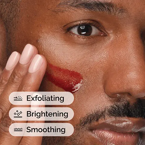 Image 1 - A close-up of a man applying a red facial product to his cheek, with three labels below the image reading Exfoliating, Brightening, and Smoothing.
              Image 2 - Image shows a skincare regimen with three products: Squalane Cleanser for cleansing skin and removing makeup, AHA 30% + BHA 2% Peeling Solution for exfoliating, and Natural Moisturizing Factors + HA for supporting the skin barrier, along with the text A regimen for hydrated and brighter-looking skin.