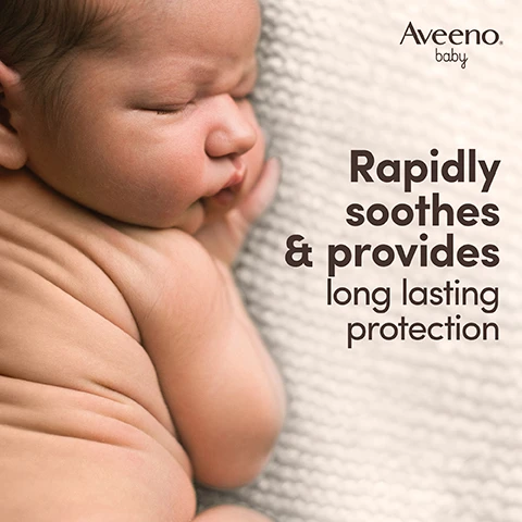 Image 1 - A peaceful baby is curled up on a textured white blanket, with the text that reads, Rapidly soothes & provides long lasting protection, and the logo for Aveeno baby.
              Image 2 - A tube of Aveeno baby daily care nappy cream for sensitive skin is shown, featuring a light striped design, and accompanied by oat plants and promotional text, which states With oat extract, The power of oat for baby’s sensitive skin, and the product volume of 100 ml.
              Image 3 - A close-up image of a baby wrapped in a soft blanket with text that reads contains zinc oxide, known to create a breathable barrier to protect the skin.
              Image 4 - Image shows a tube of Aveeno Baby daily care nappy cream for sensitive skin with illustrations and text stating Unscented, Formula free from dyes, and High tolerance formula, along with a badge that reads Pediatrician & Dermatologist Tested.
              Image 5 - Two Aveeno Baby products are displayed, including a bottle of daily care hair and body wash and a tube of daily care nappy cream, with visible text that reads Soothe & protect your babys sensitive skin from Day 1.