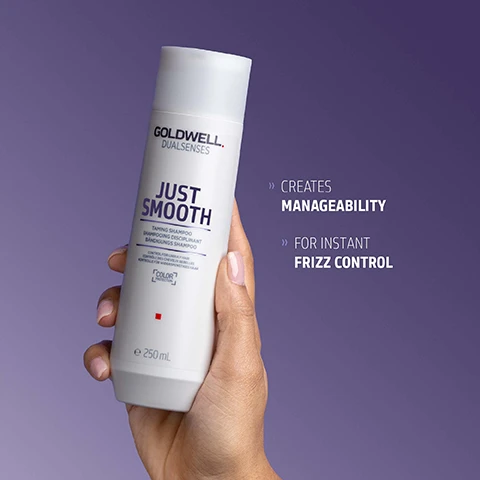 Image 1 - A hand holds a white bottle of Goldwell Dualsenses Just Smooth Taming Shampoo 250 mL, set against a purple background, with text beside it that reads Creates Manageability For Instant Frizz Control. Image 2 - A white Goldwell Dualsenses Just Smooth Taming Shampoo bottle with an open cap is presented alongside text describing its benefits: KUKUI NUT OIL It is known for its moisturizing effect The active ingredient combination helps to even the hair surface and smoothes the hair structure for improved manageability, easy detangling and frizz control, and on the bottle itself: GOLDWELL DUALSENSES JUST SMOOTH Taming Shampoo SHAMPOOING DISCIPLINANT BÄNDIGUNGS SHAMPOO CONTROL FOR UNRULY HAIR CONTROLE DES CHEVEUX REBELLES KONTROLLE FÜR WIDERSPENSTIGES HAAR COLOR e 250ML. Image 3 - A white Goldwell Dualsenses Just Smooth Taming Shampoo bottle with Kukui Nut Oil for frizz control and color protection, 250 mL, is displayed on a purple background with ClimatePartner certified product climate-id.com/PBNVQ3 and CO2 measure reduce contribute text below.