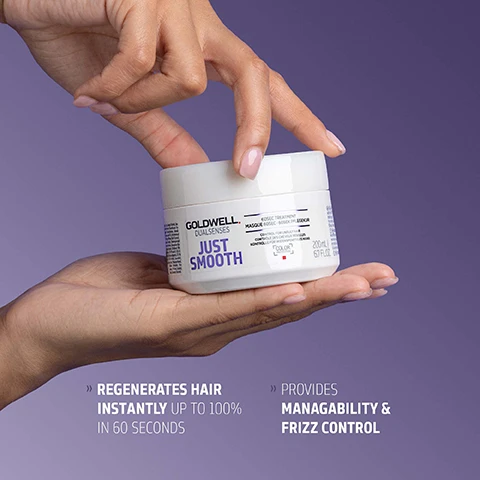 Image 1 - A persons hands hold a white jar of Goldwell Dualsenses Just Smooth 60sec Treatment Masque Rápido - Masca pe Rapidă, Control for Unruly Hair, Kontrolle für Unbändiges Haar, 200ml 6.7 Fl. Oz., with additional text stating Regenerates Hair Instantly Up To 100% In 60 Seconds and Provides Managability & Frizz Control. Image 2 - A white jar of Goldwell Dualsenses Just Smooth 60sec Treatment masque with a swirl of white product above it and a clear droplet to the side, featuring text that reads GOLDWELL DUALSENSES JUST SMOOTH 60SEC TREATMENT MASQUE 60SEC 60SEK PFLEGEKUR CONTROL FOR UNRULY HAIR CONTROLE DES CHEVEUX REBELLES KONTROLLE FÜR WIDERSPENSTIGES HAAR COLOR PROTECTION 200ML 6.7 FL.OZ. KUKUI NUT OIL It is known for its moisturizing effect The active ingredient combination helps to even the hair surface and smoothes the hair structure for improved manageability, easy detangling and frizz control. Image 3 - A white Goldwell Dualsenses Just Smooth 60sec Treatment Masque hair product jar is presented on a purple background, featuring text GOLDWELL DUALSENSES JUST SMOOTH 60SEC TREATMENT MASQUE 60SEC CONTROL AND SMOOTHNESS FOR UNRULY HAIR CONTRÔLE ET DOUCEUR POUR CHEVEUX INDISCIPLINÉS KONTROLLE UND GESCHMEIDIGKEIT FÜR UNBÄNDIGES HAAR e 500 mL, and below it, ClimatePartner certified product climate-id.com/PBNVQ3 and CO2 measure reduce contribute.