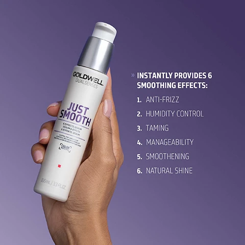 Image 1 - A hand holds a white Goldwell Dualsenses Just Smooth 6 Effects Serum pump bottle for unruly and frizzy hair, 100mL, and text on the right lists Instantly Provides 6 Smoothing Effects: 1. Anti-Frizz, 2. Humidity Control, 3. Taming, 4. Manageability, 5. Smoothening, 6. Natural Shine. Image 2 - A white Goldwell Dualsenses Just Smooth hair serum pump bottle is displayed with a clear drop and a white streak of product, featuring visible text that reads: GOLDWELL DUALSENSES JUST SMOOTH 6 EFFECTS SERUM SÉRUM À 6 EFFETS 6 EFFEKTE SERUM CONTROL FOR UNRULY HAIR CONTRÔLE POUR CHEVEUX INDISCIPLINÉS KONTROLLE FÜR UNBÄNDIGES HAAR COLOR PROTECTION 100 mL / 3.3 FL.OZ. KUKUI NUT OIL It is known for its moisturizing effect The active ingredient combination helps to even the hair surface and smoothes the hair structure for improved manageability, easy detangling and frizz control. Image 3 - A white and silver Goldwell Dualsenses Just Smooth 6 Effects Serum pump bottle, 100mL / 3.3 FL.OZ, for unruly hair with color protection, is displayed on a purple background, with additional text at the bottom reading ClimatePartner certified product, climate-id.com/PBNVQ3, and CO2 measure reduce contribute next to a QR code and the ClimatePartner logo.