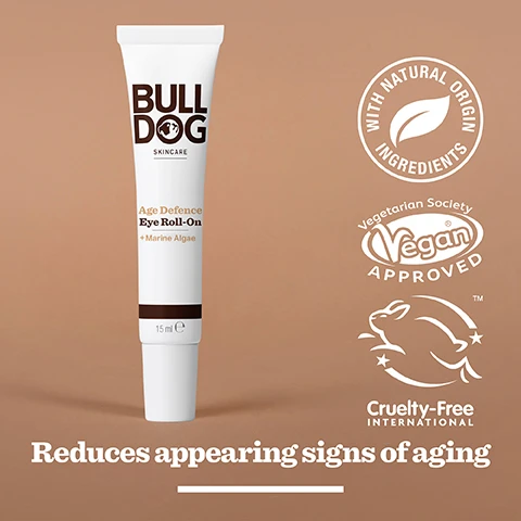 Image 2 - A white tube of Bulldog Skincare Age Defence Eye Roll-On with brown accents, featuring text that includes Age Defence Eye Roll-On, + Marine Algae, 15 ml, and icons indicating vegan approval, cruelty-free status, and natural origin ingredients, along with the phrase reduces appearing signs of aging.
              Image 3 - Image of a textured green powder with the text 97% Natural Origin, Unlock the true potential of natural origin ingredients, Marine Algae.
              Image 4 - A hand holds a small tube of Bulldog Skincare Age Defence Eye Roll-On with visible text indicating it contains marine algae and is intended for mature skin.
              Image 5 - A tube of Bulldog Age Defence Eye Roll-On sits on a marble countertop with text below it stating Reduce the appearance of fine lines and wrinkles.
              Image 6 - Three skincare products from Bulldog are displayed on a white surface: an Age Defence Serum, an Age Defence Eye Roll-On, and an Age Defence Moisturiser, with the text Reduce the appearance of fine lines and wrinkles visible beneath them.