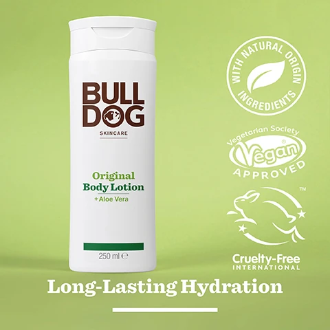 Image 2 - A white bottle of Bulldog skincare Original Body Lotion with a green label and aloe vera, set against a light green background, featuring icons for natural ingredients, vegetarian and vegan approval, and cruelty-free certification, with the text Long-Lasting Hydration.
              Image 3 - A translucent green aloe vera leaf rests on a shiny surface, accompanied by text that reads 95% Natural Origin, Unlock the true potential of natural origin ingredients, Aloe Vera.
              Image 4 - A white bottle of Bulldog Skincare Original Body Lotion with aloe vera sits against a light green background, featuring text that reads BULLDOG SKINCARE Original Body Lotion + Aloe Vera Long-Lasting Hydration 250 ml and All Day Hydration in bold.
              Image 5 - A white bottle of Bulldog Original Body Lotion with aloe vera, labeled Normal To Dry Skin, is placed on a marble surface next to a gray towel and a pumice stone, indicating long-lasting hydration.