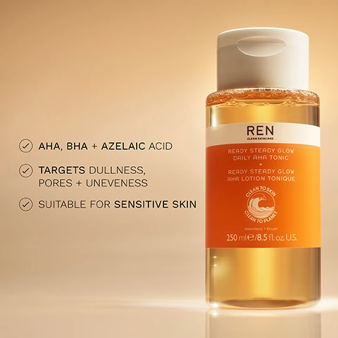 Image 1 - A bottle of REN Clean Skincare Ready Steady Glow Daily AHA Tonic with a light orange label and a white cap, featuring text that includes AHA, BHA + Azelaic Acid, targets dullness, pores + unevenness, suitable for sensitive skin, and 250 ml/8.5 fl. oz. U.S.
              Image 2 - A side-by-side comparison of a womans face before and immediately after a cosmetic procedure, with BEFORE on the left and IMMEDIATELY AFTER on the right.
              Image 3 - A graphic titled BIOACTIVES features three sections highlighting skin care ingredients: AHA from lactic acid with the text helps eliminate dead skin cells, BHA from salicylic acid with the text helps tighten the appearance of pores, and azelaic acid precursors with the text boosts radiance and evens skin tone, accompanied by images of bamboo, wood, and olives.
              Image 4 - A young woman with blonde hair is smiling while holding a bottle of REN Ready Steady Glow Daily AHA Tonic, and the image features the text 100% SHOWED BRIGHTER SKIN + TIGHTER PORES* along with other product details.
              Image 5 - A bottle of REN Ready Steady Glow Daily AHA Tonic is displayed inside a glass dome with a beige background, accompanied by text stating CLINICALLY PROVEN TO: INSTANTLY BRIGHTEN SKIN* TIGHTEN PORES* VISIBLY REDUCE HYPERPIGMENTATION* *Clinical study on 50 volunteers.
              Image 6 - Image shows a collection of REN skincare products arranged against a soft, warm background. The products include a green cleansing gel, a yellow tonic, a white eye cream, and an orange moisturizer, with the words CLEANSE, EXFOLIATE, EYE SUPPORT, and MOISTURISE displayed around them.