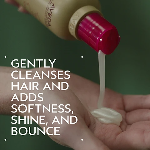 Image 2 - A hand holds an AVEDA bottle with a pink cap, dispensing a creamy, light-colored product into another palm, against a green background, with the text GENTLY CLEANSES HAIR AND ADDS SOFTNESS, SHINE, AND BOUNCE. Image 3 - A split image shows a woman with long red hair smiling, with the left side labeled BEFORE Unwashed Hair depicting her hair as wavy and a bit frizzy, and the right side labeled AFTER showing her hair smooth, straight, and shiny, with accompanying text that reads Results with Cherry Almond Softening Shampoo and Conditioner, Speed of Light Blow Dry Accelerator, Thickening Tonic, Botanical Repair™ Bond-Building Styling Crème, and Air Control Light Hold Hair Spray. Blow dried with Wooden Paddle Brush. Image 4 - A close-up of three oranges on a branch with green leaves and white blossoms, next to several dark dates, all arranged on a light beige circle against a dark green background, with the text Uplift Your Mood. A Sweet Floral Aroma With Tonka Bean, Orange, And Ylang-Ylang. Image 5 - The image titled HOW TO USE displays a four-step hair care routine: Step 1 shows hands shampooing wet hair and reads 01 CLEANSE Cherry Almond Softening Shampoo; Step 2 shows conditioner being squeezed into a hand and reads 02 CONDITION Cherry Almond Conditioner; Step 3 shows a hand spraying a product from a bottle and reads 03 PREP Speed of Light Blow Dry Accelerator; and Step 4 displays various styling products and a paddle brush and reads 04 STYLE Thickening Tonic, Botanical Repair™, Bond-Building Styling Crème, Air Control Light Hold Hair Spray & Wooden Paddle Brush. Image 6 - A split image shows a woman with blonde hair before and after a hair routine, with the left side depicting her hair as unwashed and straight, and the right side showing it styled with soft waves and appearing more voluminous, accompanied by the text BEFORE, AFTER, Unwashed Hair, and Results with Cherry Almond Softening Shampoo, Conditioner, and Leave-In Conditioner, Invati Ultra Advanced™ Thickening Foam, Texture Tonic and Woodle Paddle Brush. Blow dried with diffuser attachment and styled with curling iron. Image 7 - Three drops of a thick, light yellow cream or lotion with subtle swirls are presented on a clean white background. Image 8 - A close-up of dark green leaves and a red plant stem shows three white certification logos: a circular logo with a large V and the text 100% VEGAN repeated, the Certified B Corporation logo with a B in a circle, and the Cruelty Free International leaping bunny logo with the text Cruelty Free INTERNATIONAL.