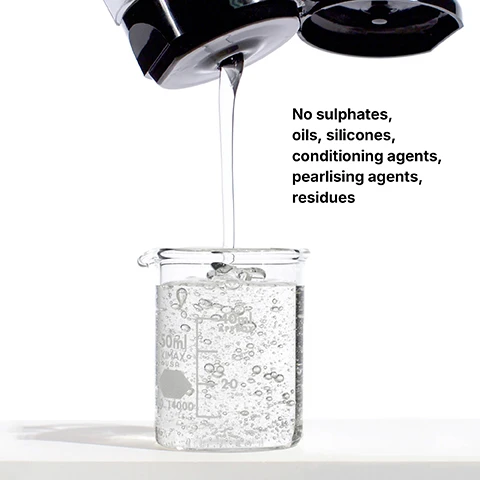 Image 1 - Clear liquid pours from a black bottle into a glass beaker filled with bubbles, next to text that says No sulphates, oils, silicones, conditioning agents, pearlising agents, residues.
              Image 2 - A large white bottle of Color Wow shampoo with a black pump has the text WOW COLOR WOW COLOR SECURITY SHAMPOO 100% clean, residue-free nettoyer as 100%, sans résidu leaves no residues behind to dull color, weigh hair down or impede hair growth ne laisse aucun résidu qui pourrait ternir la couleur, alourdir les cheveux ou empêcher leur repousse 946 ml e 32 FL OZ SUPER SIZE.