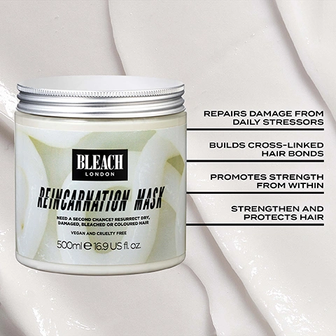Image 1 - A white jar of Bleach London Reincarnation Mask with a silver lid is shown against a light background with product residue, featuring text that reads BLEACH LONDON REINCARNATION MASK NEED A SECOND CHANCE? RESURRECT DRY, DAMAGED, BLEACHED OR COLOURED HAIR VEGAN AND CRUELTY FREE 500ml e 16.9 US fl. oz., and beside it, text highlighting benefits: REPAIRS DAMAGE FROM DAILY STRESSORS BUILDS CROSS-LINKED HAIR BONDS PROMOTES STRENGTH FROM WITHIN STRENGTHEN AND PROTECTS HAIR. Image 2 - A split image showing the back of a person with reddish-orange hair, where the left side labeled BEFORE shows frizzy, undefined hair, and the right side labeled AFTER shows more defined, less frizzy curls. Image 3 - A light grey, creamy background displays Reincarnation Mask hero ingredients, illustrated with wheat stalks and sunflowers, listing: Reincarnation Mask Hero Ingredients, Hydrolyzed Wheat Protein, which builds cross-linked protein bonds that strengthen strands from within and protect against breakage; Hydrolyzed Vegetable Protein; and Sunflower Seed Extract, which is antioxidant-rich, helps protect hair against UV damage and reduce colour fade; the product also doesnt contain ammonia, parabens, bleach or colour. Image 4 - The image shows a purple and black graphic that reads VEGAN & PETA APPROVED next to a white bunny logo, and a neon yellow-green banner with purple text that reads FOR ALL HAIR TYPES. Image 5 - The image displays three white containers of Bleach London Reincarnation hair care products, including a shampoo, a conditioner, and a mask, with accompanying text that reads A MULTI-BOND STRENGTHENING AND NOURISHING ROUTINE, followed by the labels Bleach London Reincarnation Shampoo New life with every wash nourishing shampoo with bond restoring technology formulated to gently cleanse and strengthen bleached, coloured, dry and damaged hair 300ml e 10.14 fl. oz. for all hair types vegan and cruelty free, Bleach London Reincarnation Conditioner New life with every wash nourishing conditioner with bond restoring technology formulated to moisturise, strengthen & detangle bleached, coloured, dry and damaged hair 300ml e 10.14 fl. oz. for all hair types vegan and cruelty free, Bleach London Reincarnation Mask Need a second chance? Resurrect dry, damaged, bleached or coloured hair vegan and cruelty free 500ml e 16.9 US fl. oz., and additional text Creatine bolsters electrostatic bonds and Vegetable Proteins help to build cross-linked protein bonds.