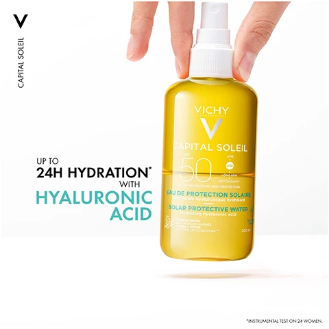 Image 1 - A yellow bottle of Vichy Capital Soleil sunscreen spray with a pump nozzle, labeled with the products SPF rating of 50, and text stating UP TO 24H HYDRATION WITH HYALURONIC ACID.
              Image 2 - A bottle of Vichy Capital Soleil sunscreen spray with a yellow liquid, set against a backdrop of water droplets, featuring the text ULTRA-LIGHT ULTRA-FRESH and CAPITAL SOLEIL SPF 50.
              Image 3 - A woman with braided hair is holding a bottle of Vichy Capital Soleil sunscreen, looking directly at the camera with a neutral background, featuring the text HYPOALLERGENIC. INVISIBLE FINISH.
              Image 4 - Image shows two sun protection products: a white bottle labeled UV-AGE DAILY for face and a yellow spray bottle labeled SOLAR WATER for body, with the text ADVANCED UV PROTECTION prominently displayed above.