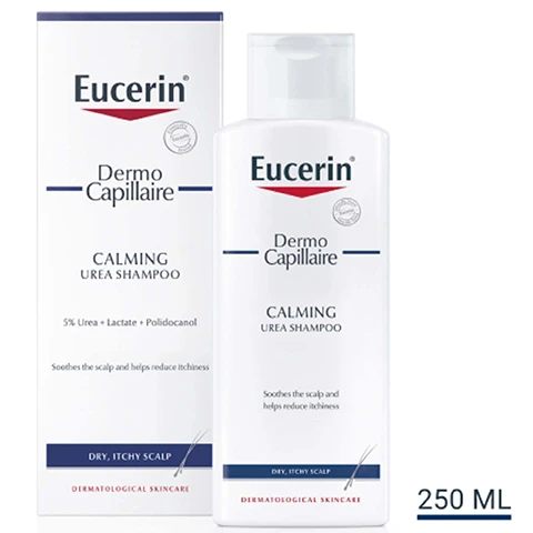 Image 1 - A bottle and box of Eucerin Dermo Capillaire Calming Urea Shampoo, with the bottle showing the product name, key ingredients, and benefits while the box prominently displays the same information.
              Image 2 - A woman smiles while holding a bottle of Eucerin calming cleansing and displaying a list of key benefits: helps ease itching and irritation, relieves dryness, fragrance-free.
              Image 3 - A hand holds a bottle of Eucerin Dermo Capilaire Calming Ultra Medi Shampoo on the left, while the right side features three icons with the text: Moisturising, Anti-itch, Fragrance-free.
              Image 4 - Blue background with the text Consumers Confirm, Soothes the Scalp and Reduces the Itchiness, and a note about product testing with details regarding patients and conditions.
              Image 5 - An image showing two Eucerin products: a bottle labeled Dermo Capillaire Calming Urea Scalp Treatment and another labeled UreaRepair Plus 10% Urea Lotion, with the text DISCOVER MORE at the top.
              Image 6 - A woman applies a product to her scalp with one hand while looking to the side, and the image includes text that reads USE UP TO TWICE DAILY, MORNING AND EVENING, WITH OR WITHOUT WASHING HAIR FIRST and HOW TO USE.