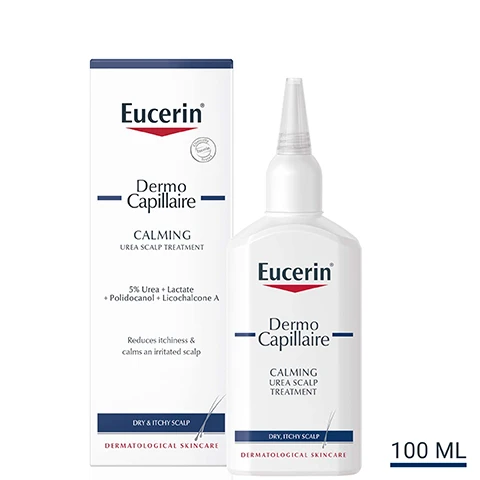 Image 1 - A bottle of Eucerin Dermo Capillaire calming urea scalp treatment is shown next to its box, with text indicating it contains 5% Urea and is designed to reduce itchiness and calm an irritated scalp, labeled as 100 ML.
              Image 2 - A smiling woman in a white tank top holds a bottle of scalp treatment on her shoulder, with a list of key benefits next to her that includes protects the scalp from drying out, soothes the scalp and reduces itchiness, and leave-on formula.
              Image 3 - A person holds a white bottle labeled Eucerin DermoCapillaire Calming Treatment with a pointed nozzle, alongside three icons and text that reads Protection, Anti-Itch, and Moisturising.
              Image 4 - Diagram of two chemical structures with labels, showing Licorice Chalcone A on the left and Urea on the right.
              Image 5 - A blue background with white text stating clinically proven results, reduces itchiness and calms irritated scalp, followed by a footnote about a study on calming tonic efficacy.
              Image 6 - Two Eucerin skincare products are displayed side by side: on the left is a bottle labeled Dermo Capillaire Calming Urea Shampoo, and on the right is a bottle labeled UreaRepair Plus 10% Urea Lotion, with the text DISCOVER MORE above them.