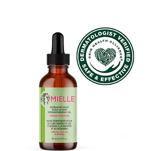 Image 4 - An amber bottle with a dropper contains a clear hair and scalp strengthening oil, set against a light green background with text that reads features more than 30 essential oils and extracts, infused with biotin, and use for daily hair care or scalp treatments.
              Image 5 - An amber bottle of Mielle Rosemary Mint Scalp & Hair Strengthening Oil with a dropper is positioned on a light gray podium, against a pink background, with instructions on how to use it: Scalp Treatment, Daily Use, and Split End Care.