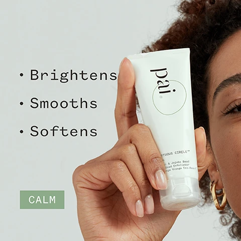Image 1 - A person with curly hair holds a tube of skin care product labeled pai in their right hand, with bullet points to the left reading Brightens, Smooths, Softens, and a green box at the bottom that says CALM.
              Image 2 - A skincare product tube labeled prai with the text describing its gentle exfoliation benefits, along with visible logos indicating organic and vegan certifications, and the quote attributed to Milly H.