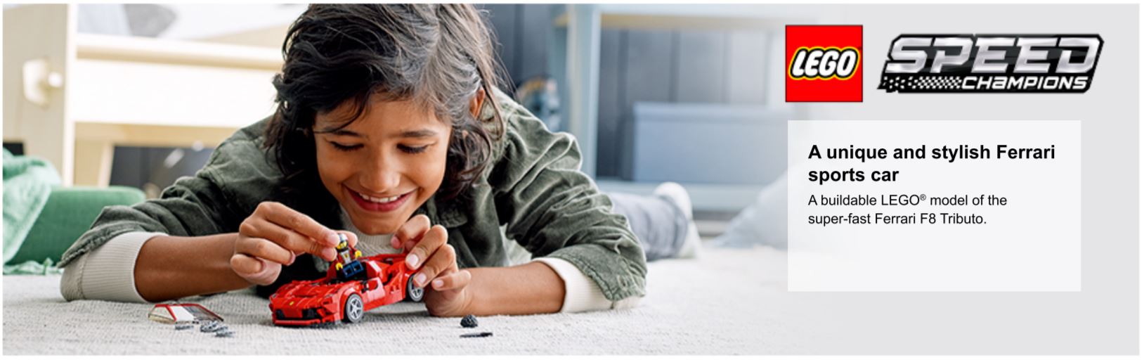 child playing with ferarri car model