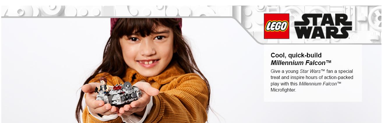 child holding Starwars lego piece