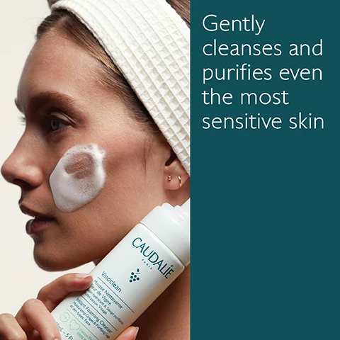 Image 1 - A woman with a headband applies a foamy cleanser to her cheek while holding a bottle of Caudalie Vinoclean; visible text reads Gently cleanses and purifies even the most sensitive skin.
              Image 2 - A bottle of Caudalie Vinoclean Instant Foaming Cleanser is surrounded by green grapes, sage leaves, and flowers on a clean surface, with visible text stating Green grape hydrates, Sage purifies, and Chamomile soothes skin.
              Image 3 - Image shows two skincare products side by side: a bottle of Make-up Removing Oil on the left and a pump bottle of Instant Foaming Cleanser on the right, with descriptions below each product listing their key features: Oil texture, dissolves makeup even waterproof, face and eyes for the oil and foam texture, gently cleanses and purifies, sensitive skin for the cleanser.
              Image 4 - Image of a bottle of Caudalie Vinoclean Instant Foaming Cleanser with green foliage beside it, showing recycling instructions that read 1 Recycle the bottle in the recycling bin 2 Recycle the pump with Terracycle.
              Image 5 - An arrangement of five skincare products by Caudalie, including Micellar Water, Make-up Removing Oil, Cleansing Milk, Instant Foaming Cleanser, and Moisturizing Toner, all labeled with their respective names.