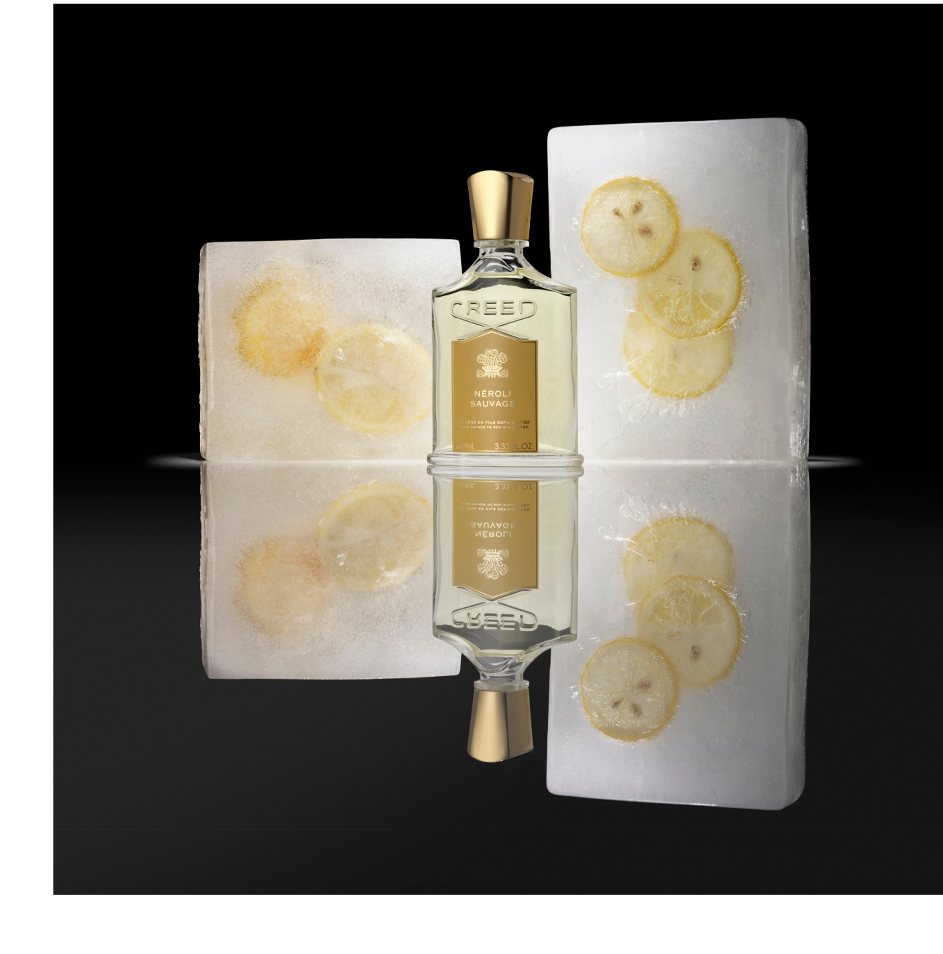 A Creed Neroli Sauvage perfume bottle is positioned between two ice blocks containing frozen lemon slices, reflected on a dark surface, with the text CREED NÉROLI SAUVAGE PÈRE EN FILS DEPUIS 1760 FROM FATHER TO SON SINCE 1760 100ML 3.33 FL.OZ visible on the bottle.