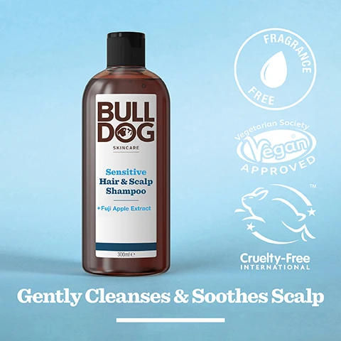Image 2 - A bottle of Bulldog Skincare Sensitive Hair and Scalp Shampoo with Fuji Apple Extract is displayed against a light blue background, featuring text that reads Gently Cleanses & Soothes Scalp, along with vegan and cruelty-free logos.
              Image 3 - Close-up image of sliced red Fuji apples with the text 100% Natural Fragrances and Fuji Apple Extract.
              Image 4 - A person holds a brown bottle of Bulldog Skincare Sensitive Hair & Scalp Shampoo, which features a label with text about added Fuji Apple Extract and includes a recycling symbol stating 100% Recycled PCR Plastic Bottle.
              Image 5 - A person is pouring a bottle of shampoo from a dark bottle with the label facing upwards, while one hand is positioned underneath to catch the product, with the text Gently Cleanses & Soothes Scalp visible on the image.
              Image 6 - Two bottles of Bulldog Skincare products are displayed on a light-colored tile surface, featuring a Peppermint & Eucalyptus Shower Gel and a Sensitive Hair & Scalp Shampoo, with the text Start the Day Right visible below.
