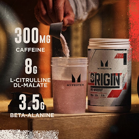 A hand is shown holding a scoop of powder above a clear container with a pink liquid inside, next to a tub of MyProtein Origin pre-workout, with the visible text stating 300 mg caffeine, 8 g L-Citrulline DL-Malate, and 3.5 g Beta-Alanine.
