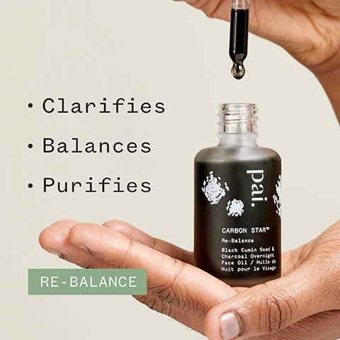 Image 1 - A hand holding a dropper bottle labeled Païl CARBON STAR™ Re-Balance Black Cumin Seed & Charcoal Overnight Face Oil with the words Clarifies, Balances, and Purifies displayed beside it, and a green rectangle below reading RE-BALANCE.
              Image 2 - An image of a dropper bottle with a dark serum and a drop of serum on a white surface, featuring the text 76% said skin looked clearer and logos for Soil Association, Cosmos Natural, Vegan, and Certified B Corporation, along with a note about a 4 week independent user trial on 49 subjects.