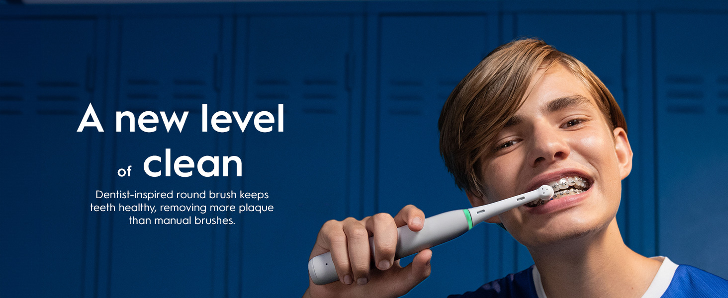 Person with an electric toothbrush. "A new level of clean" claim showing dental benefits