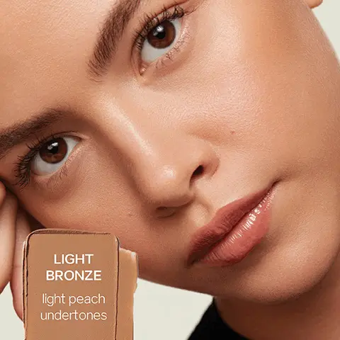 Light Bronze- light peach undertones. Deep Bronze- warm red undertones. Dark Bronze- cool dark undertones. How to Sun Melt. All-over Bronze- Buff out areas where the sun naturally hits. Paired with Dew Blush- Apply Dew Blush on top for a pop of colour. On eyelids- Blend onto eyelids as a creamy, earth-toned eyeshadow. Soft Sculpt- Apply to perimeters of face. Buff inwards. All-over bronze- apply in a sweeping motion under and across cheekbone. Blend lightly across the bridge of the nose. Glide across forehead and along hairline. Tap into eyelid from the lash line to crease. Soft Sculpt- Dab and press upward into cheek from cheekbone to temple. Glide under the chin along the entire jawline. Blend across forehead sweeping toward the hairline. Tap into crease and blend up and out. Soothing and smoothing colloidal oatmeal. Hydrating and nourishing grapeseed oil. Skin protection elderberry extract. Sun Melt+ Big Brush= BFFs for a bronzed #saieglow. How to recycle Sun Melt. Use it all up and then wipe away any remaining bronzer from the jar. Place it in your home recycling bin or repurpose your clean jar as a jewelry case or vitamin holder. Our Sun Melt jar is made of 50% PCR- post consumer recycled plastic. Medium Bronze- warm golden undertones. Fair Bronze- fair neutral undertones. Tan Bronze- medium to tan neutral undertones.