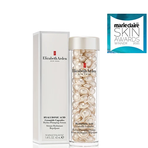Image 1 - A bottle of Elizabeth Ardens Hyaluronic Acid Ceramide Capsules with a white box, and a sticker in the top right corner that says marieclaire SKIN AWARDS WINNER 2021.
              Image 2 - An overhead view of a white cream in a circular container against a light blue background, with the text Silky Smooth, Lightweight Serum.
              Image 3 - A clear container holding white capsules is shown against a bright blue background; the visible text reads PURE Benefit-rich ingredients, POTENT Freshness-sealed to protect from light and air, and PRECISE Premeasured, single-dose treatments.
              Image 4 - A woman holding a small pearl-like skincare product near her face is smiling against a soft blue background, with the text Plump & Hydrate and 98% see plumper skin* displayed prominently.
              Image 5 - A close-up image of a hand holding a small, clear gel capsule, with text that reads Twist, Squeeze, Smooth, a sun icon, and instructions that say HOW TO USE: Apply on Face, Neck and Décolleté.
              Image 6 - A group of skincare serum capsules in clear containers, featuring various colors and sizes, with the text Pure. Potent. Precise. Discover Ceramide Capsule Serums for Every Skin Concern displayed in a stylish font above.