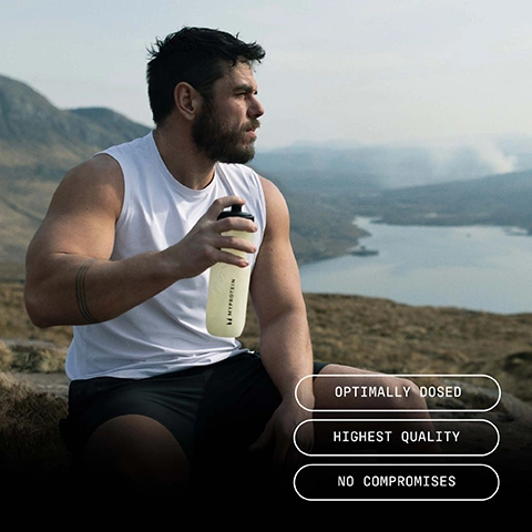 Image 1 - A muscular man with a short beard is sitting outdoors, holding a clear water bottle labeled MYPROTEIN, with a scenic landscape and lake in the background; visible text includes OPTIMALLY DOSED, HIGHEST QUALITY, and NO COMPROMISES.