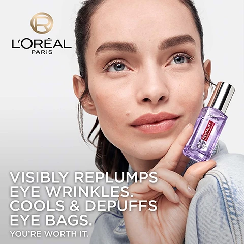 Image 1 - A woman with clear skin holds a purple LOréal Revitalift eye serum bottle, with the text LORÉAL PARIS, REVITALIFT, VISIBLY REPLUMPS EYE WRINKLES. COOLS & DEPUFFS EYE BAGS. YOURE WORTH IT. Image 2 - A LOréal Revitalift Filler Hyaluronic Acid serum bottle stands amidst abstract purple shapes, with text that reads Wrinkles appear reduced by up to 5 years in just 2 weeks, Visibly: Improve dark circles, Replump eye wrinkles. Image 3 - A cosmetic product image featuring a purple rollerball applicator between two circular fluid elements, one clear with bubbles and one orange, with text: POWERED BY 1.5% HYALURONIC ACID DEEPLY MOISTURIZES & VISIBLY REPLUMPS FINE LINES & WRINKLES AROUND THE EYES, and 1% CAFFEINE RE-ENERGIZES SKIN TO REDUCE APPEARANCE OF DARK CIRCLES AND PUFFY BAGS, and a circular R logo. Image 4 - A hand in a white glove holds a dropper with three silver balls above an open purple bottle of LOreal Revitalift eye serum, with visible text that reads CLINICALLY EFFECTIVE ON 100% OF WOMEN, the bottle label text LORÉAL PARIS REVITALIFT PLUS HYALURONIC ACID 2.5% HYALURONIC ACID EYE SERUM, and fine print at the bottom stating EQUIVALENCE IN YEARS OF APPEARENCE IMPROVEMENT OF CROWS FEET WRINKLES & UNDER EYES LINES 81 WOMEN CLINICAL SCORAGE AFTER 2 WEEKS BEFORE / AFTER FROM DIGITAL SIMULATION OF AVERAGE CLINICAL RESULTS. RESULTS MAY VARY FROM AN INDIVIDUAL TO ANOTHER. Image 5 - A man with curly hair and a beard applies an eye serum with a rollerball applicator to his under-eye area while holding the product bottle, with text above that reads CLINICALLY EFFECTIVE ON ALL SKIN TYPES. Image 6 - A purple image displays three LOréal Revitalift Filler skincare products, including a large dropper serum bottle, a smaller serum bottle, and a cream jar, arranged diagonally with lines connecting them to a routine, along with the text Complete Your Hyaluronic Routine, LOreal Revitalift Filler Hyaluron Ampoule Serum, LOreal Revitalift Filler Hyaluron, LOreal Revitalift Filler Day, Step 1 Eye Serum, Step 2 Face Serum, Step 3 Face Cream.