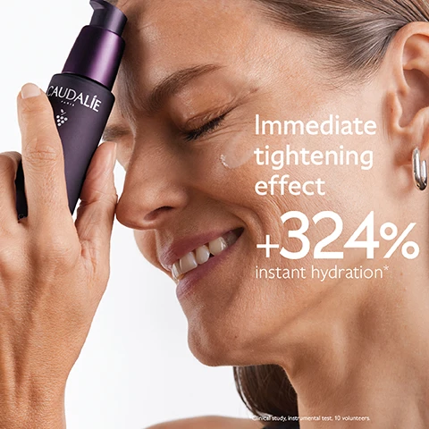 Image 1 - A woman is smiling while applying a skincare product to her face, with visible text stating Immediate tightening effect +324% instant hydration*.
              Image 2 - A purple background features a bottle of Caudalie Premier Cru serum surrounded by dark grapes, with text stating Natural plumping filler improves skin volume, Longevity patent stimulates youth proteins, and Niacinamide smoothes and evens skin tone.
              Image 3 - A woman is smiling while holding a bunch of dark grapes near her face, with visible text that says Targets all signs of ageing, followed by checkmarks for Wrinkles, Dark spots, and Volume.
              Image 4 - Image shows three bottles of Caudalie serums on a purple background with the text Which serum suits your skin? above and labels for each serum: Premier Cru - Complete anti-ageing, Resveratrol-Lift - Improve wrinkles & firmness, and Vinoperfect - Boost radiance & reduce dark spots.
              Image 5 - An image displaying four different cream textures labeled as follows from top to bottom: The Serum, The Cream, The Rich Cream, and The Eye Cream, against a purple background with the text The Premier Cru Routine at the top.
              Image 6 - A dark purple bottle of Caudalie Premier Cru The Serum is shown against a matching background, with text highlighting New Premier Cru The Serum and additional information about a New longevity formula and New natural plumping filler from rosewood.
              Image 7 - Image shows a hand holding a dropper bottle of Premier Cru The Serum against a purple background, with instructions for recycling: 1. Recycle glass bottle using at-home recycling 2. Recycle with Terracycle, and includes the Terracycle logo.