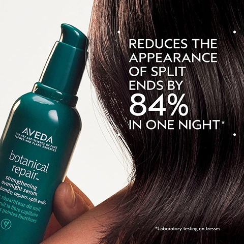 Image 2 - A hand holds a dark teal Aveda Botanical Repair serum bottle against a backdrop of dark hair and a light background, with text on the bottle stating AVEDA THE ART AND SCIENCE OF PURE FLOWER AND PLANT ESSENCES botanical repair™ strengthening overnight serum builds bonds; repairs split ends sérum réparateur de nuit renforce la fibre capillaire répare les pointes fourchues, and additional text on the right side reading REDUCES THE APPEARANCE OF SPLIT ENDS BY 84% IN ONE NIGHT* with a footnote *Laboratory testing on tresses. Image 3 - A split image shows a persons long, blonde-brown hair before and after treatment, with the left side displaying duller, slightly frizzy hair and the right side showing shinier, smoother hair, accompanied by the text BEFORE, AFTER, Unwashed Hair, Results with botanical repair™ strengthening shampoo, strengthening conditioner and strengthening overnight serum. Blow dried with round bristle hair brush. Image 4 - A dark green background with a circular graphic featuring swirling green and yellow substances in the center, and two white dots in the top-left and bottom-left corners. The text reads PLANT-DERIVED BOND BUILDING MOLECULE, PLANT-DERIVED BOND BUILDING MOLECULE PENETRATES DEEP WITHIN THE CORTEX BUILDING NEW BONDS FOR STRONGER HAIR, NOURISHING MACRO-GREEN BLEND, WITH AVOCADO, GREEN TEA AND SACHA INCHI OILS SMOOTHS THE CUTICLE TO DETANGLE AND HELP PREVENT BREAKAGE. Image 5 - A split image shows a womans profile, with frizzy, curly dark hair on the left and smooth, straight dark hair on the right, labeled BEFORE, AFTER, Unwashed Hair, and Results with smooth infusion™ anti-frizz shampoo, conditioner, and perfectly blow dry and botanical repair™ overnight repair serum. Blow dried with round bristle hair brush. Image 6 - An image illustrating a four-step hair care routine on a green leaf background with water droplets, showing HOW TO USE: 01 CLEANSE with hands shampooing hair, Botanical Repair Strengthening Shampoo; 02 CONDITION with a hand dispensing product, Botanical Repair Strengthening Conditioner; 03 REPAIR with a hand dispensing serum, Botanical Repair Strengthening Overnight Repair Serum and Botanical Repair Intensive Strengthening Masque Light; 04 STYLE with a hand combing wet hair, Botanical Repair Strengthening Bond-Building Styling Creme. Image 7 - A smooth, pearlescent white smear of cream or lotion is centered on a white background. Image 8 - The image features three white certification logos against a dark green leafy background with a hint of red plant: a circular logo with a V and the text 100% VEGAN 100% VEGAN, a Certified B Corporation logo with a B in a circle and the text Certified B Corporation, and the Cruelty Free International leaping bunny logo with the text Cruelty Free INTERNATIONAL.
